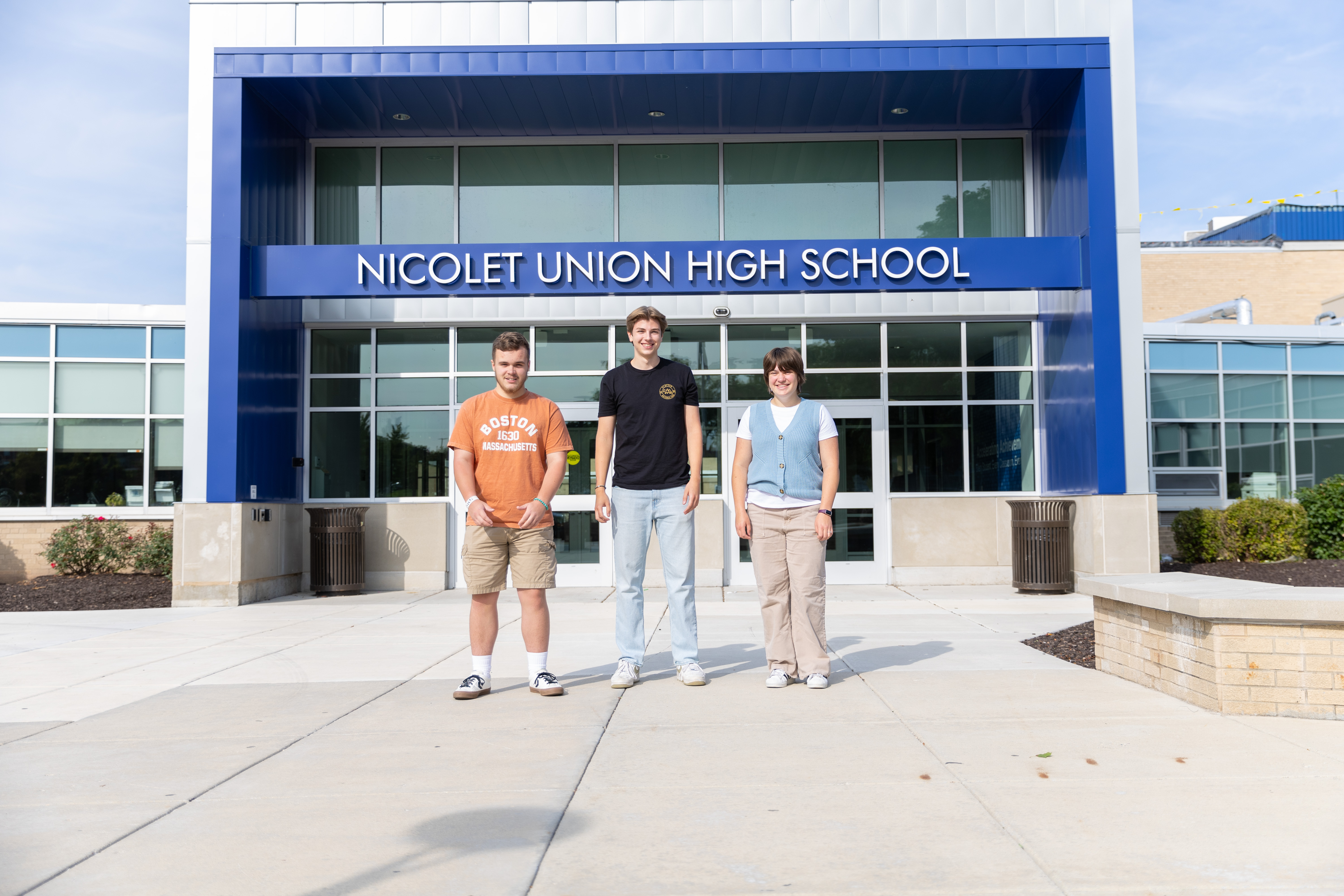 picture of three students smiling