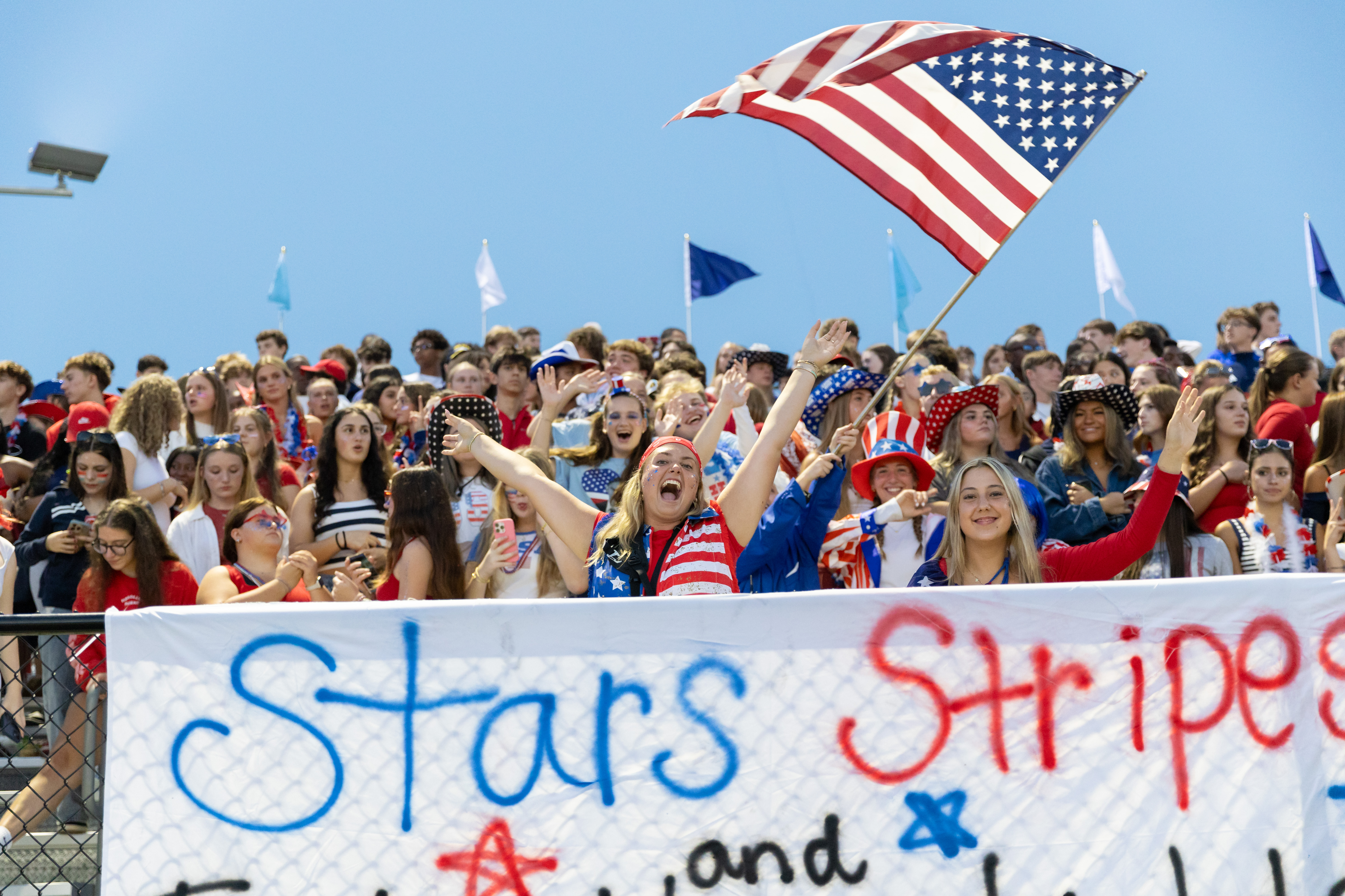 students cheering at a football game