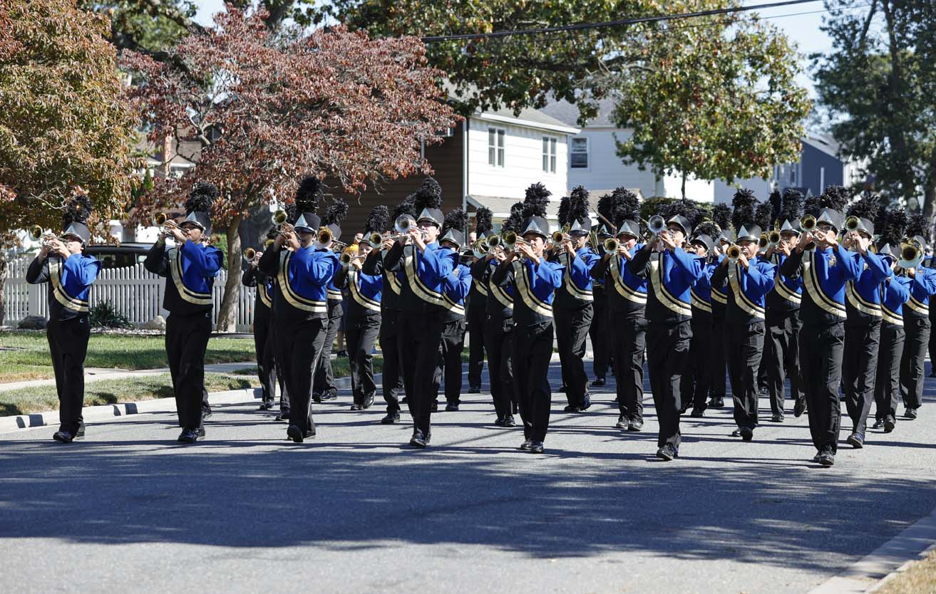 East Meadow students marching in parade.