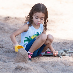 preschool student playing in the sand
