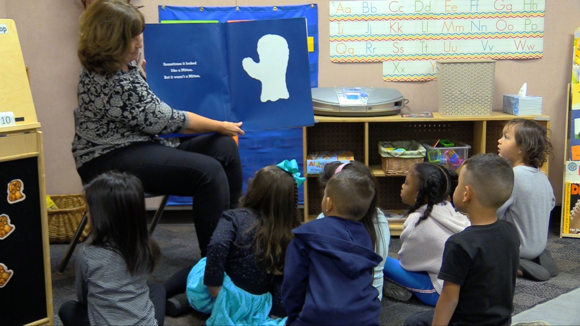 pre kindergarten students listening to the book It Looked Like Spilled Milk