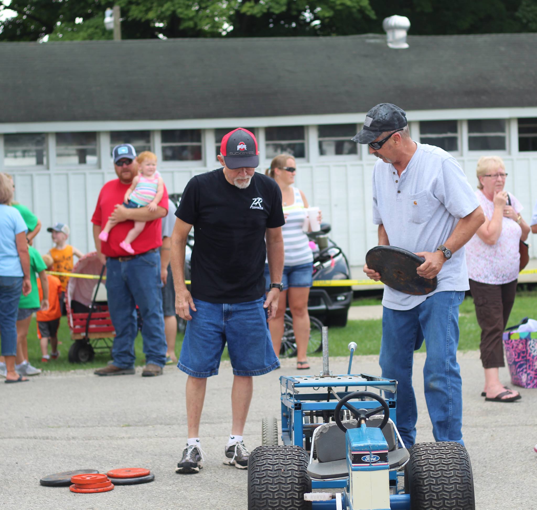 Mr. Ebert & Mr. Morris helping with the Kiddie Tractor Pull