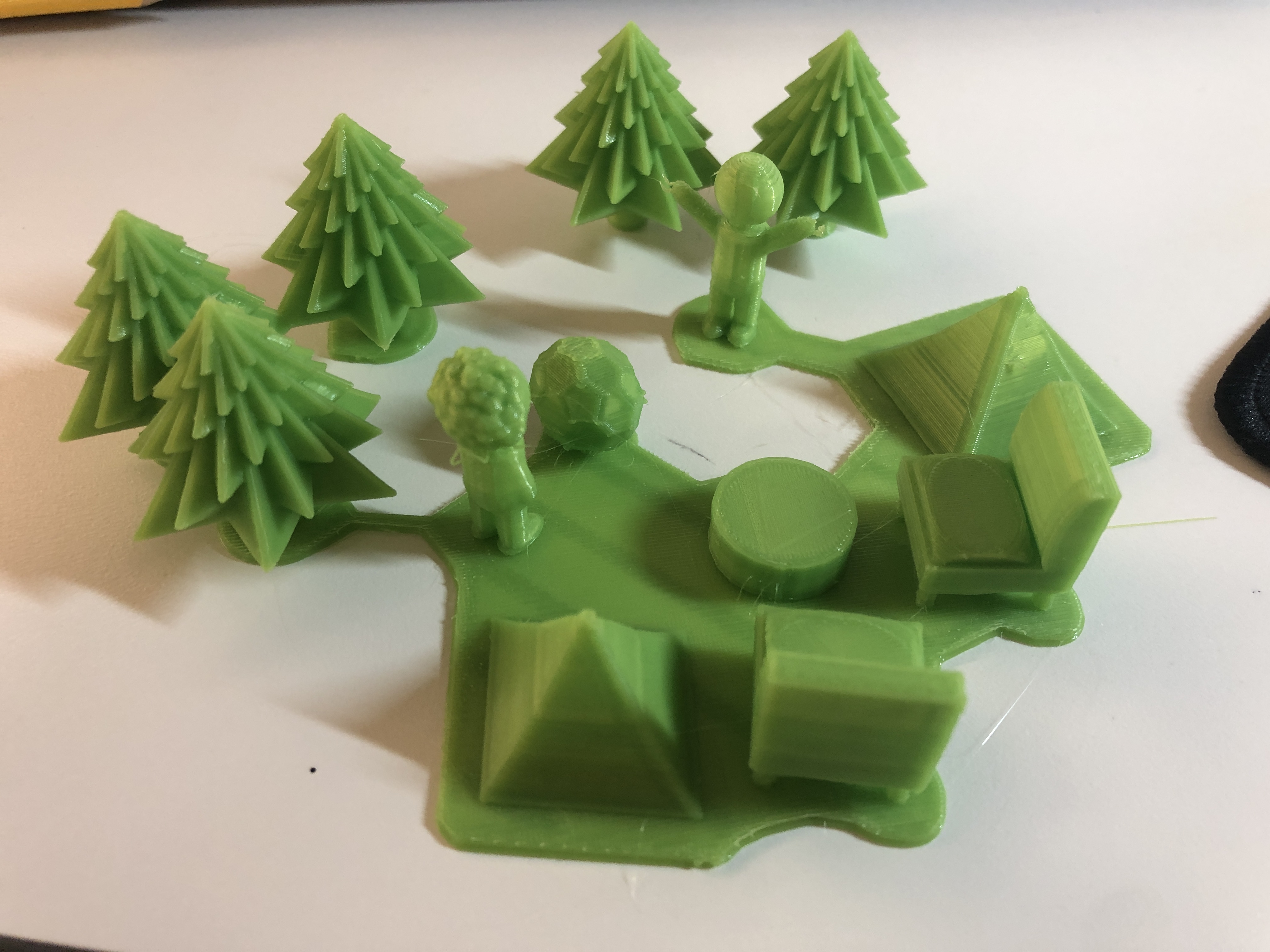 3D printed house and pine trees