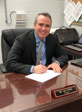 principal at his desk