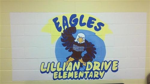 A mural that reads "Eagles: Lillian Drive Elementary" around an eagle with a fierce expression