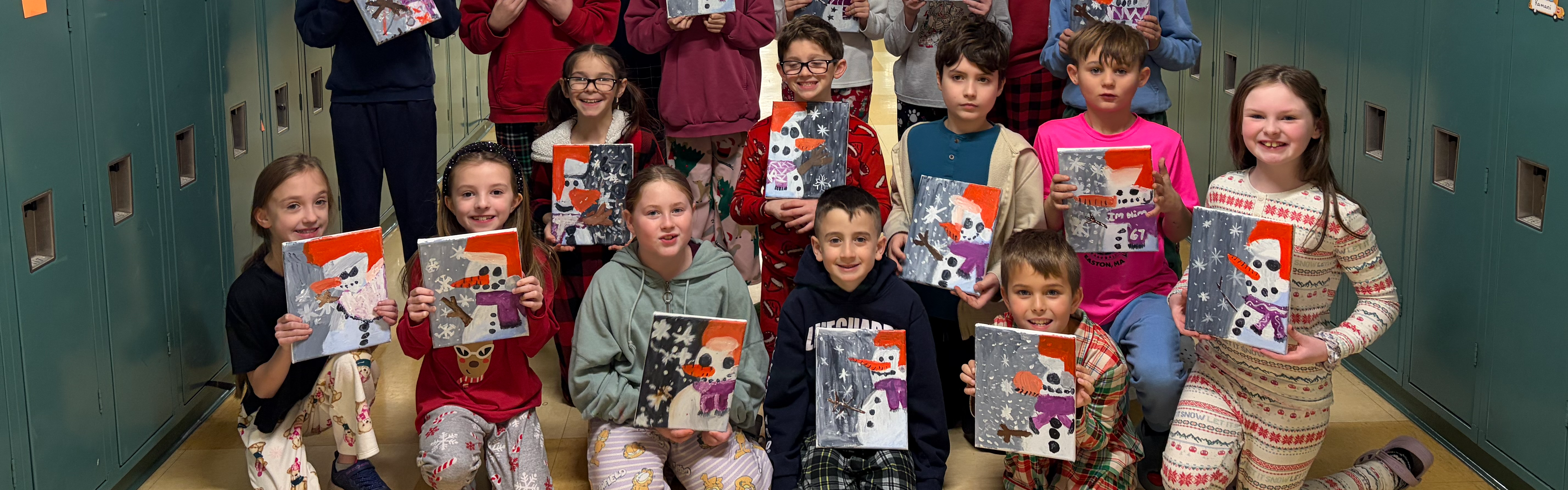 Students showing off they snowman paintings.