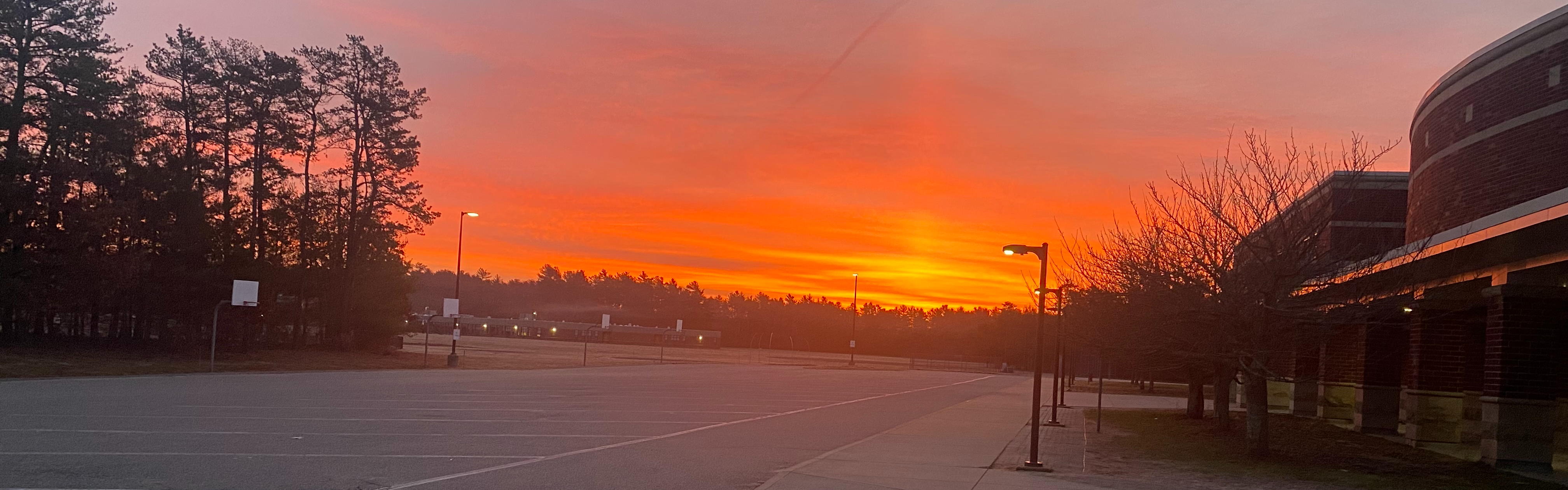 image of a sunrise over the parking lot