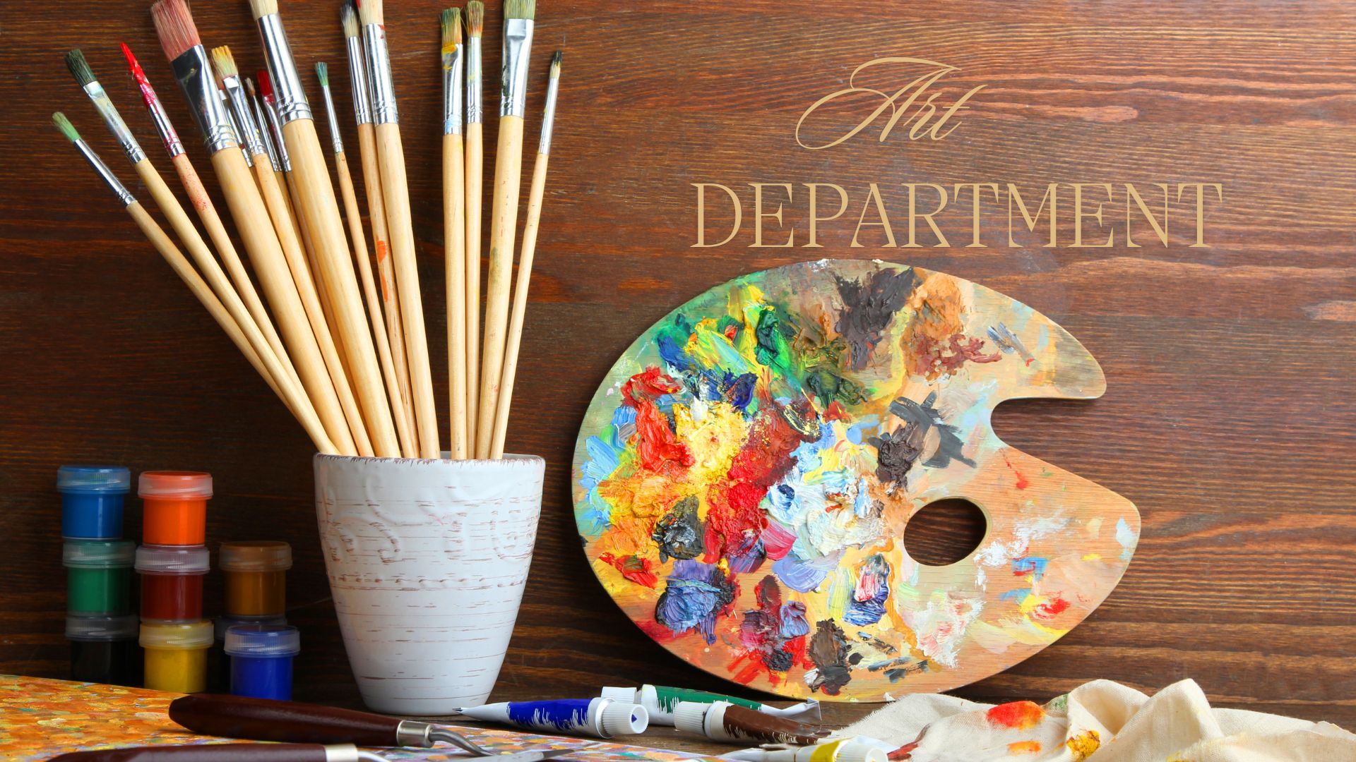 image of an art pallet and painting supplies with text of Art Department