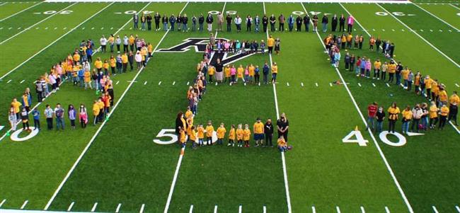BES spelled out on a field