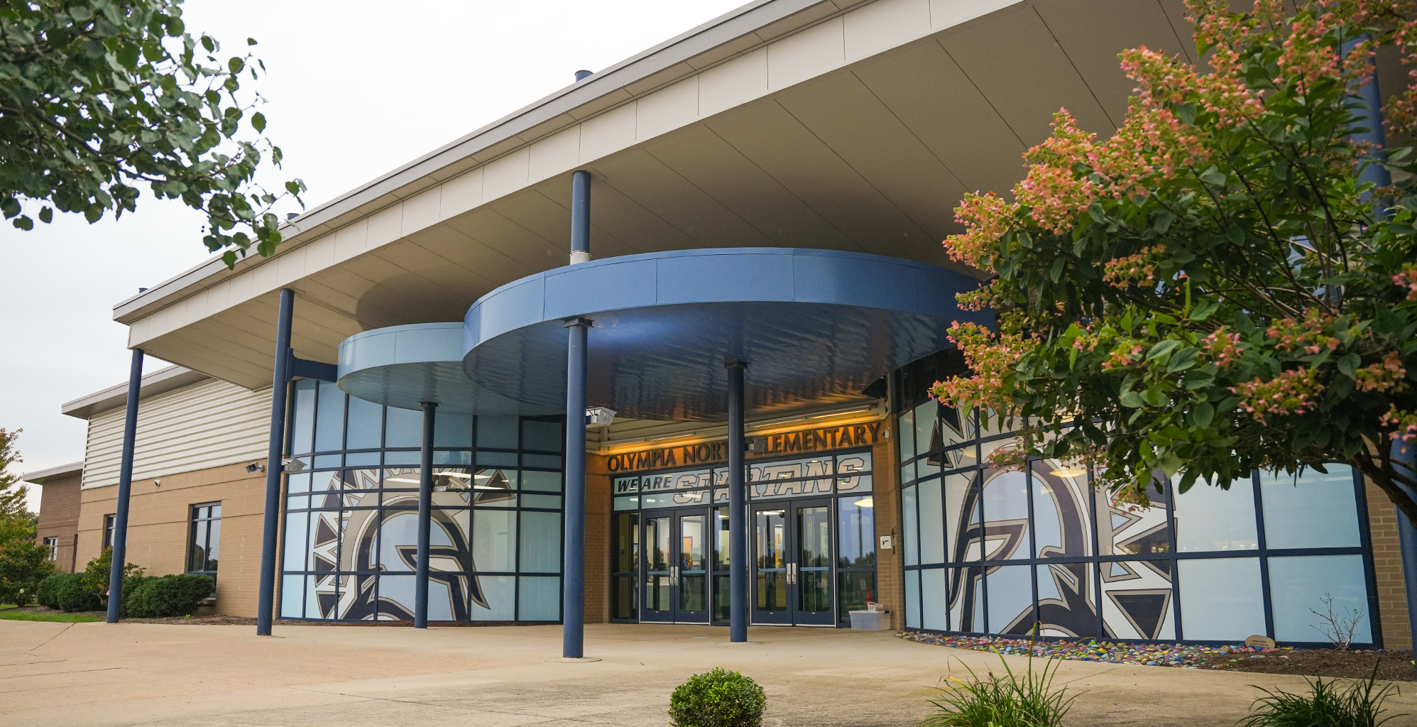 School building exterior with blue and white lettering