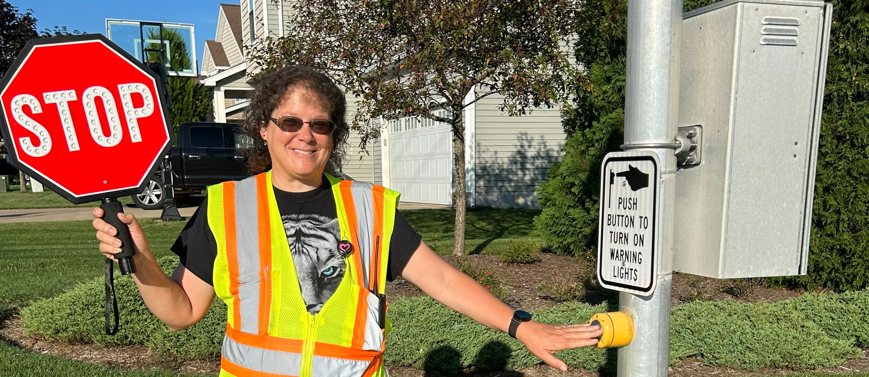 Crossing Guard holding a STOP sign