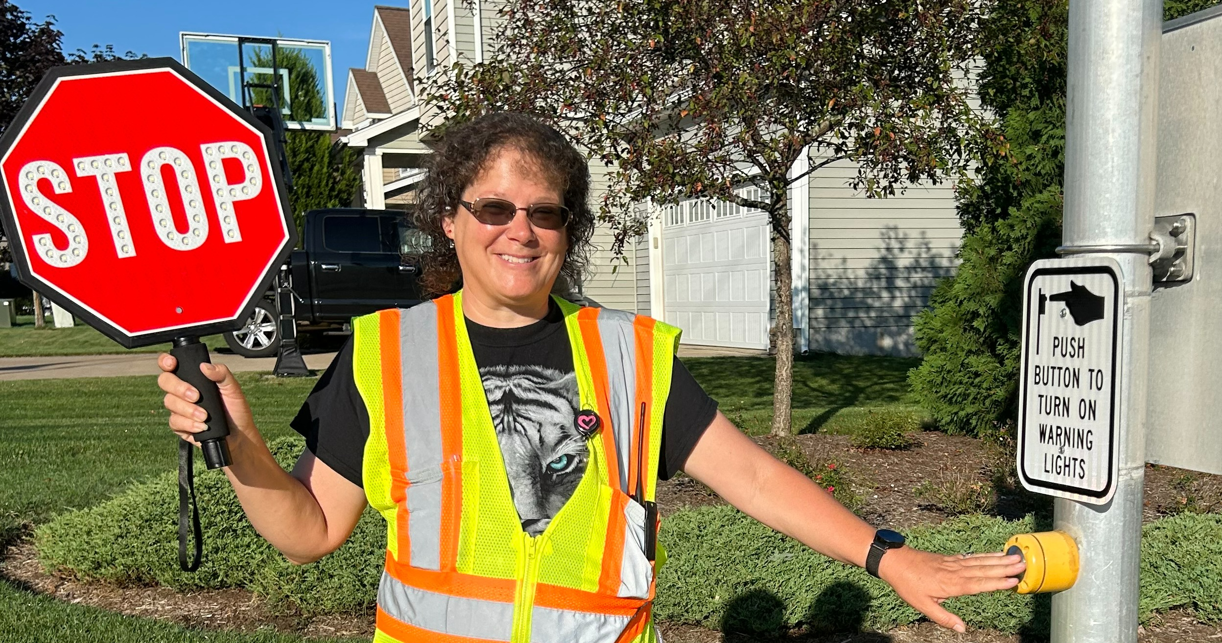 Crossing Guard holding a STOP sign
