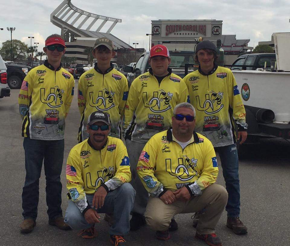 teammates in yellow jerseys