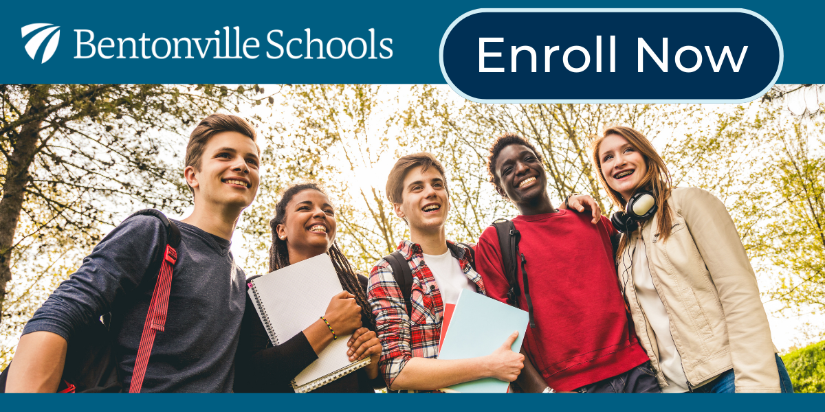 Students smiling in front of trees and enroll now button