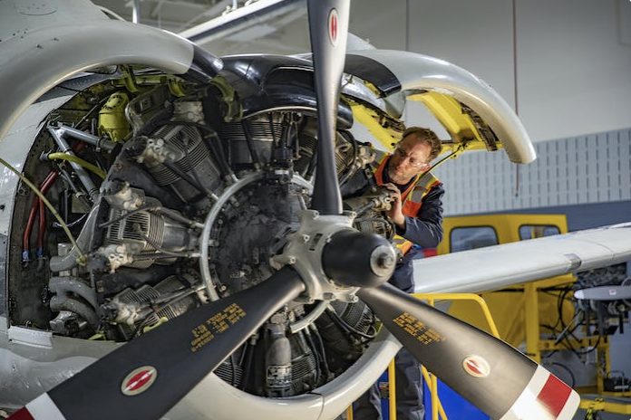 mechanic working on airplane engine