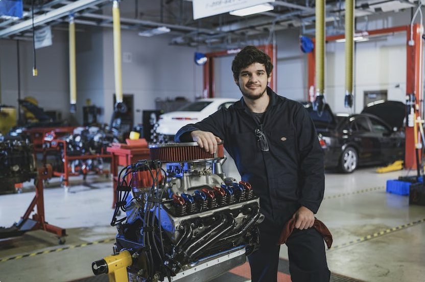 automotive tech student working on car engine
