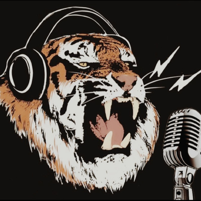 Tiger with headphones and a microphone.