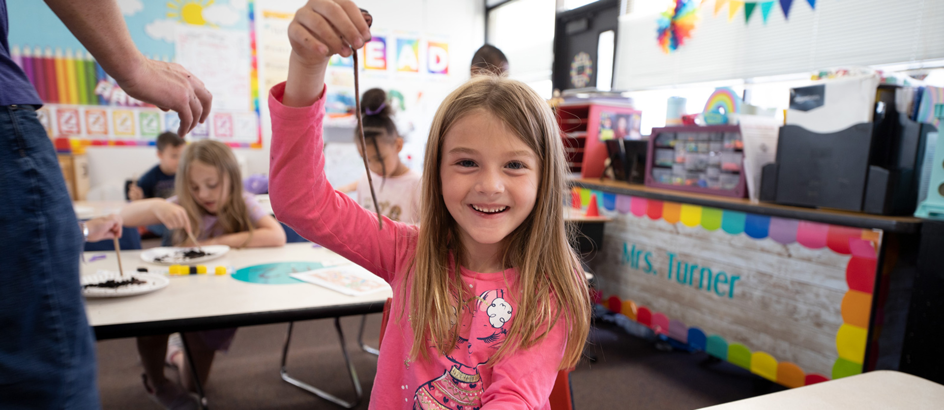 student smiling in classroom