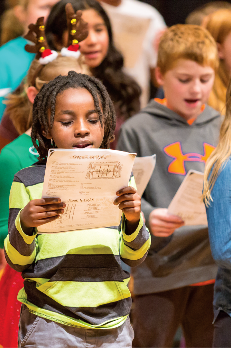 children singing in holiday choir concert