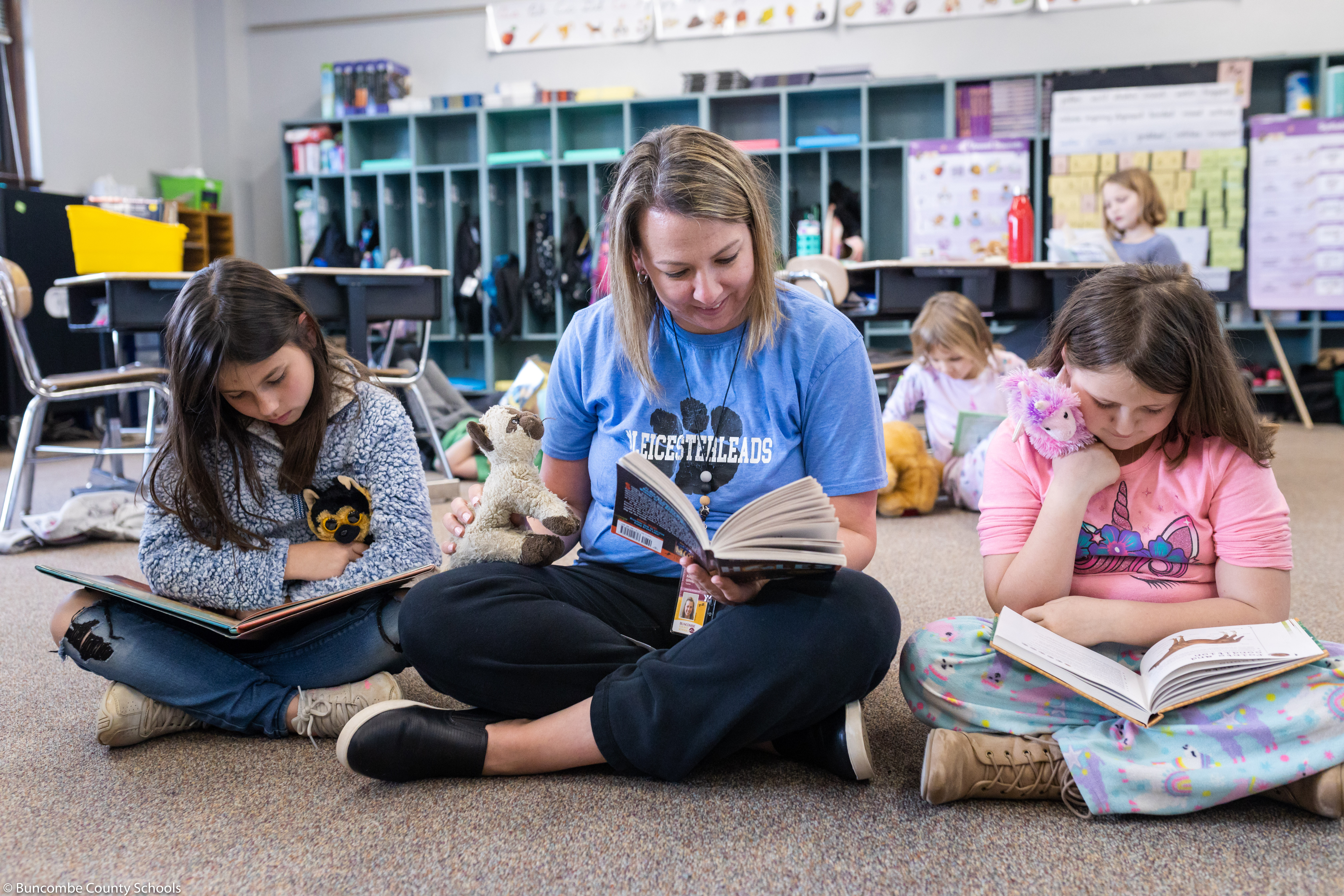 teacher reading with students