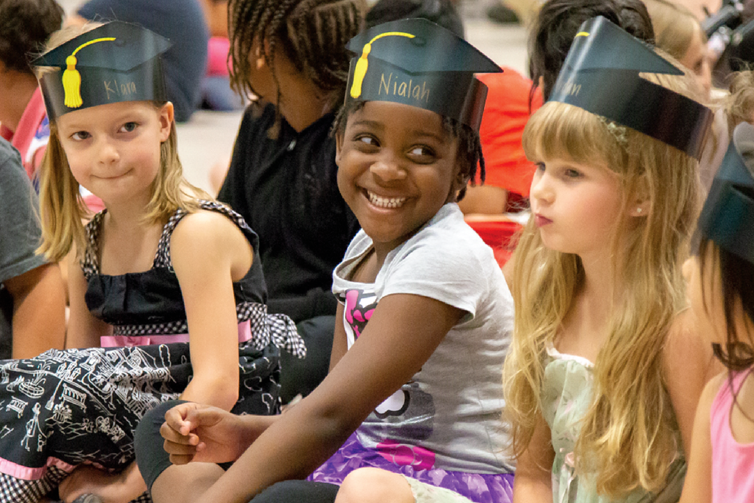 students smiling in gym