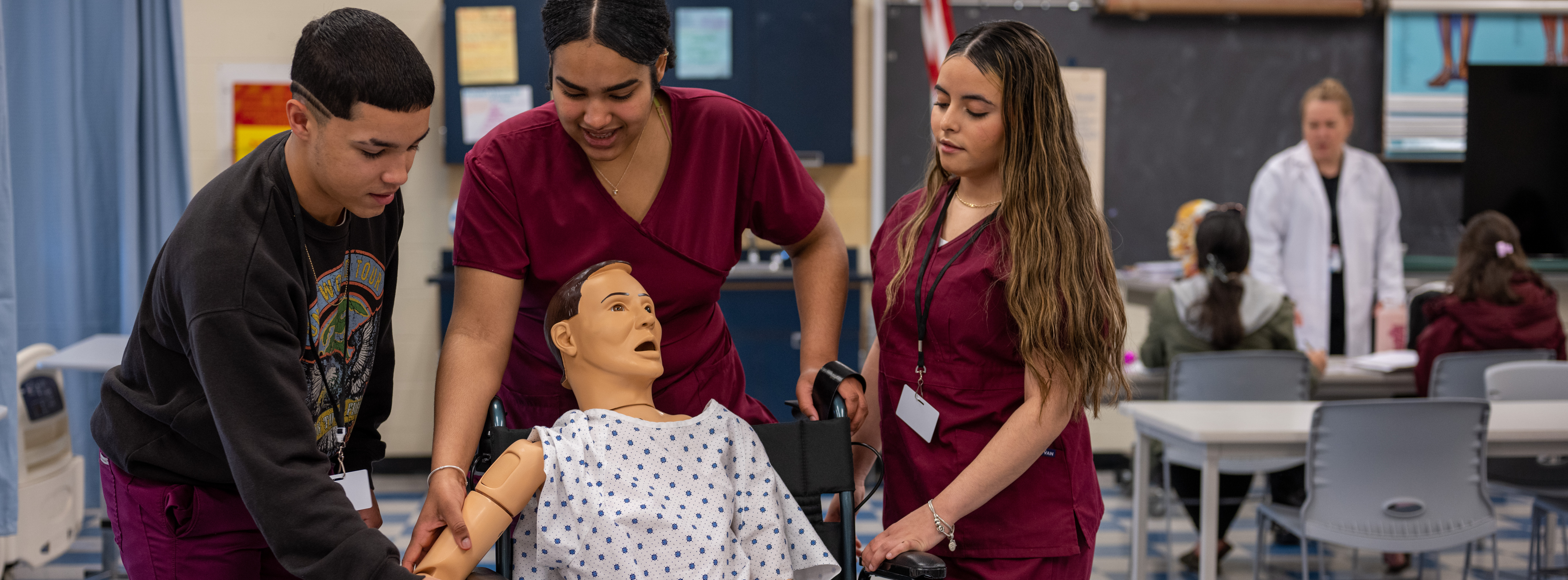 Three medical assistant students at HHS Dean working together.