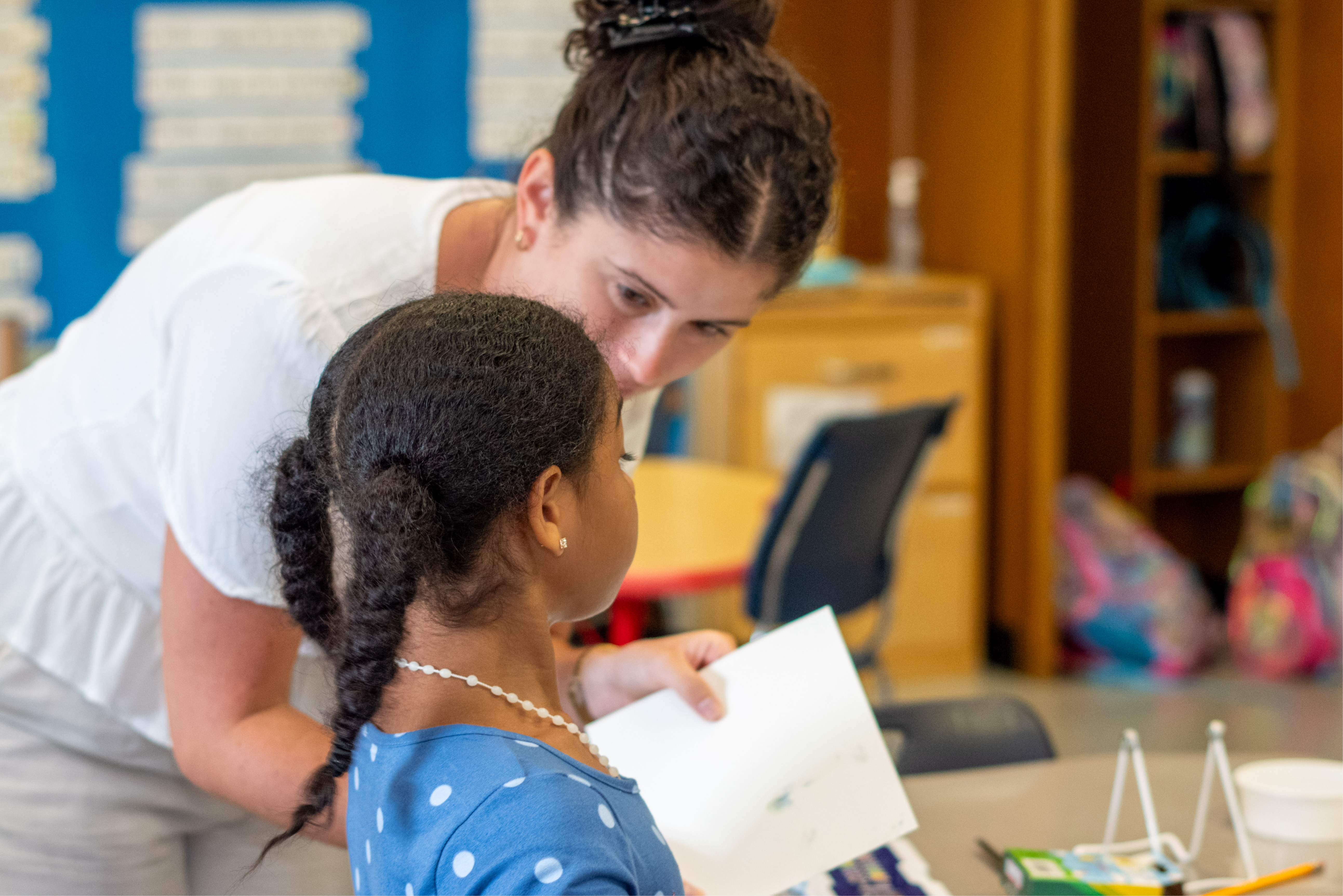 teacher talking to student 