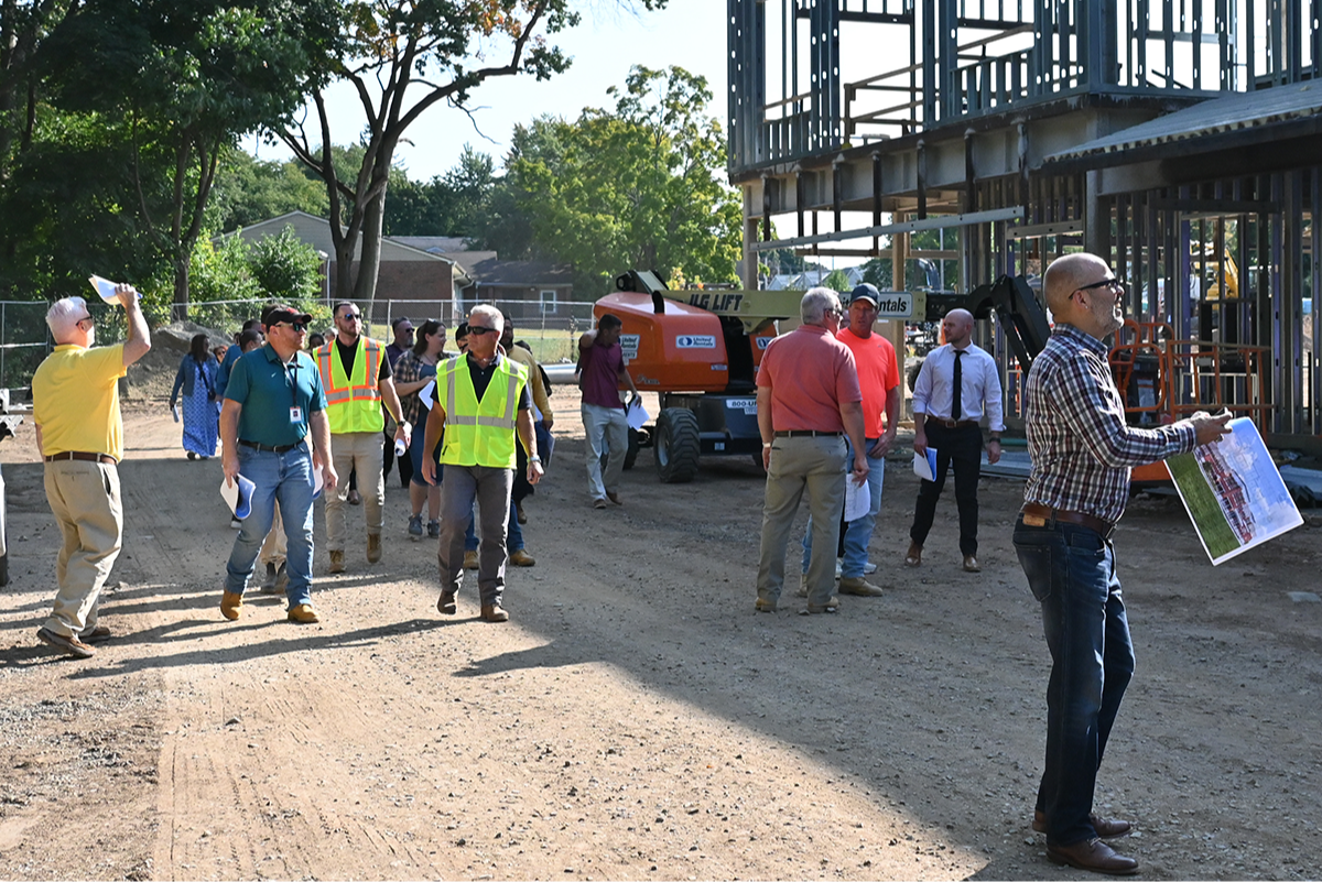 people touring construction site