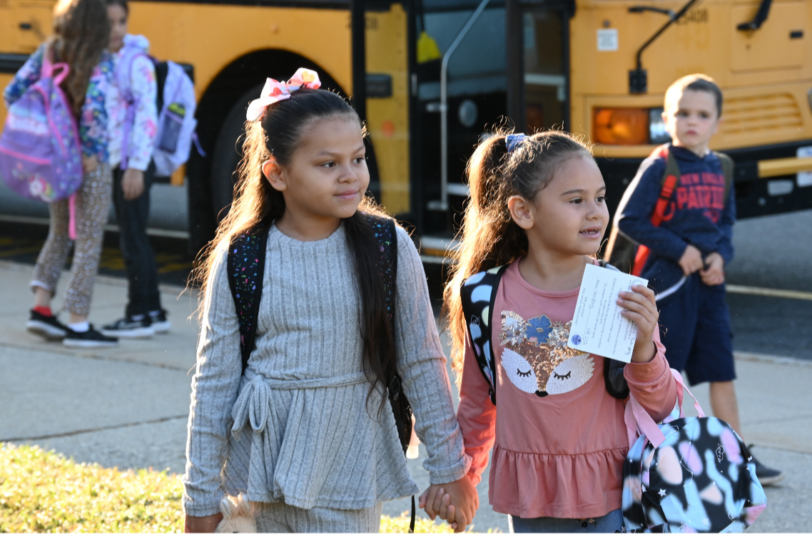 Two McMahon students arrive to school  after taking the bus