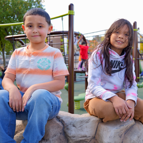 Two Lawrence students enjoy the new playground