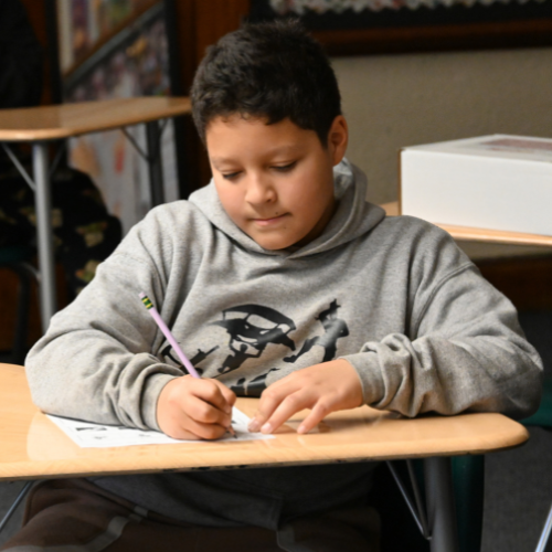 A Metcalf student completes a worksheet