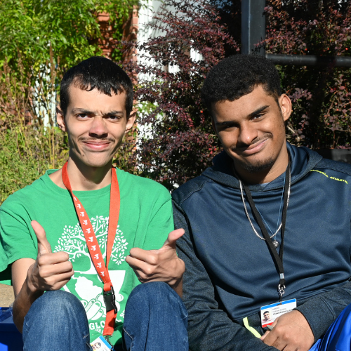 Two Transitions students smile at the camera