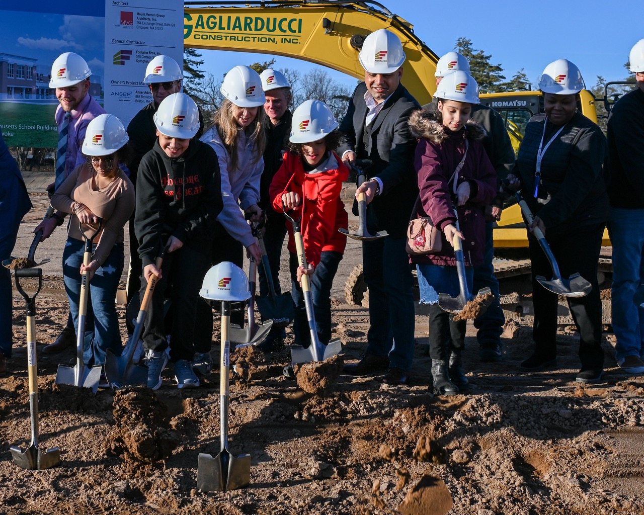 group of people smiling at groundbreaking