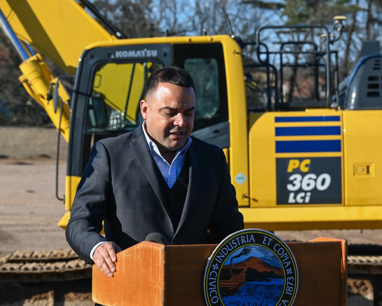 Mayor Garcia in front of large machinery