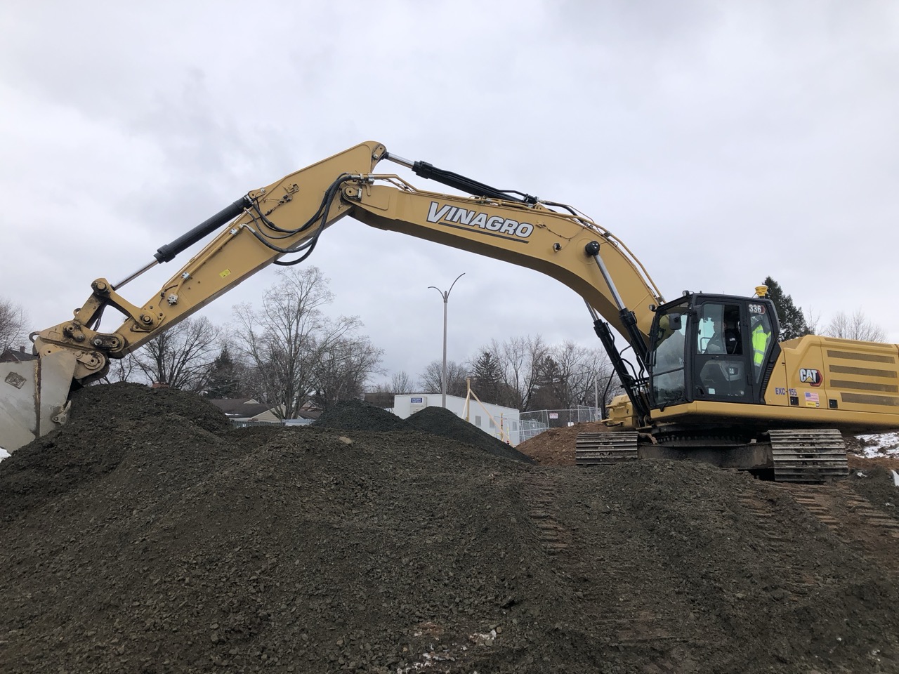 Yellow construction equipment digs