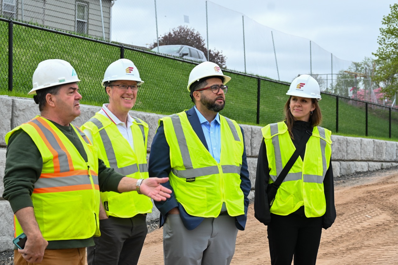 Group of administrators look at construction