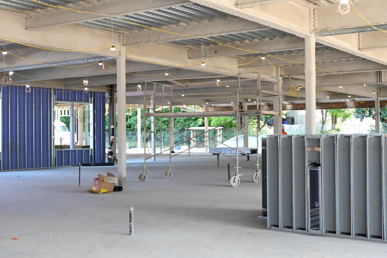 Looking inside the first floor where ceilings are being insulated