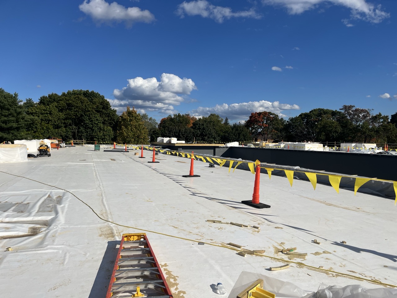 Nearly finished roof with flags and cones