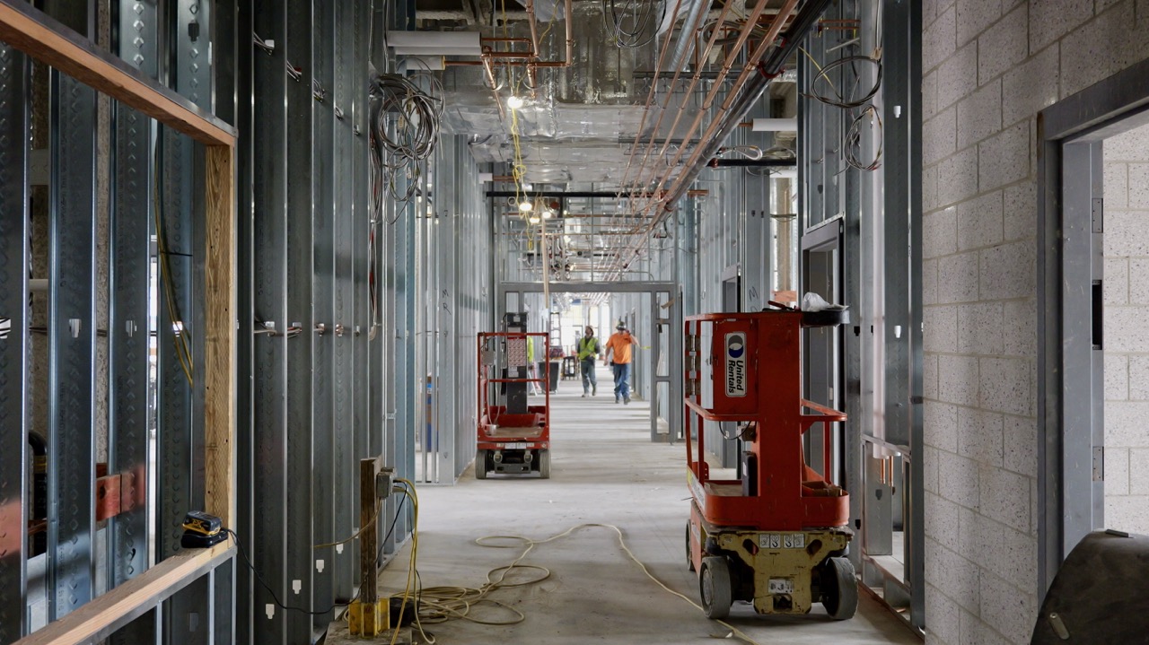 Inside the enclosed but unfinished hallway