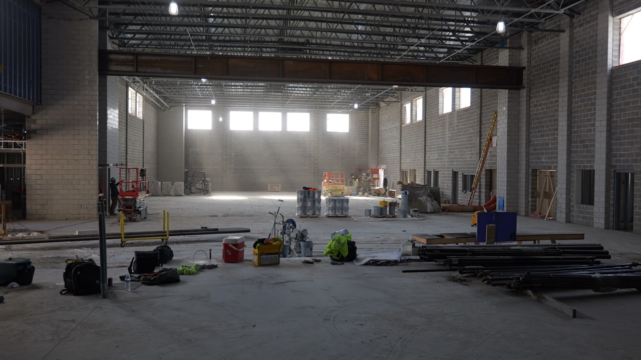 Inside the cafeteria/gymnasium area where light pours in