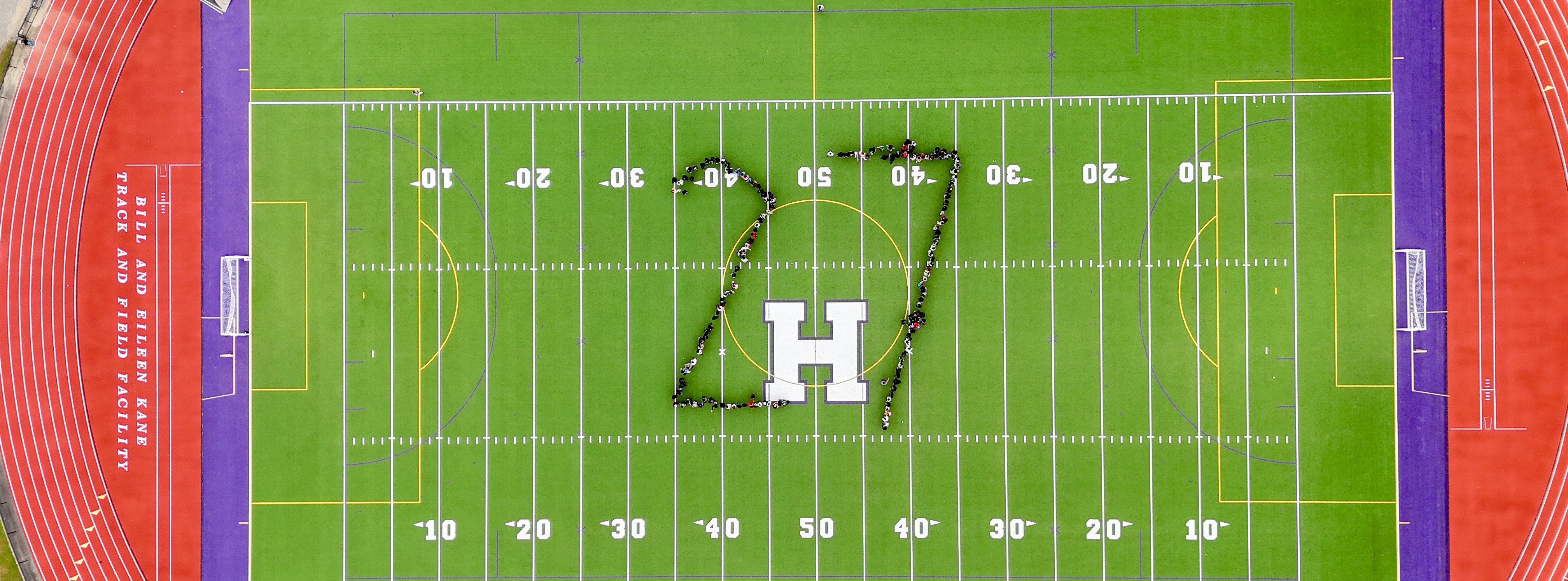 Students at HHS North spell out "26" on the field
