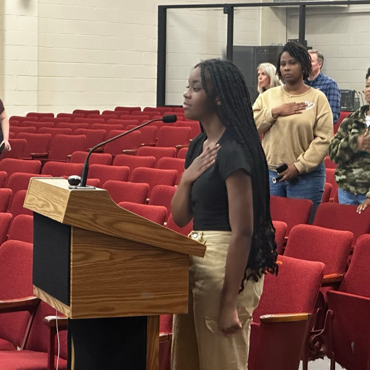 Peasley Middle School student Aysha Williams leading the Pledge of Allegiance