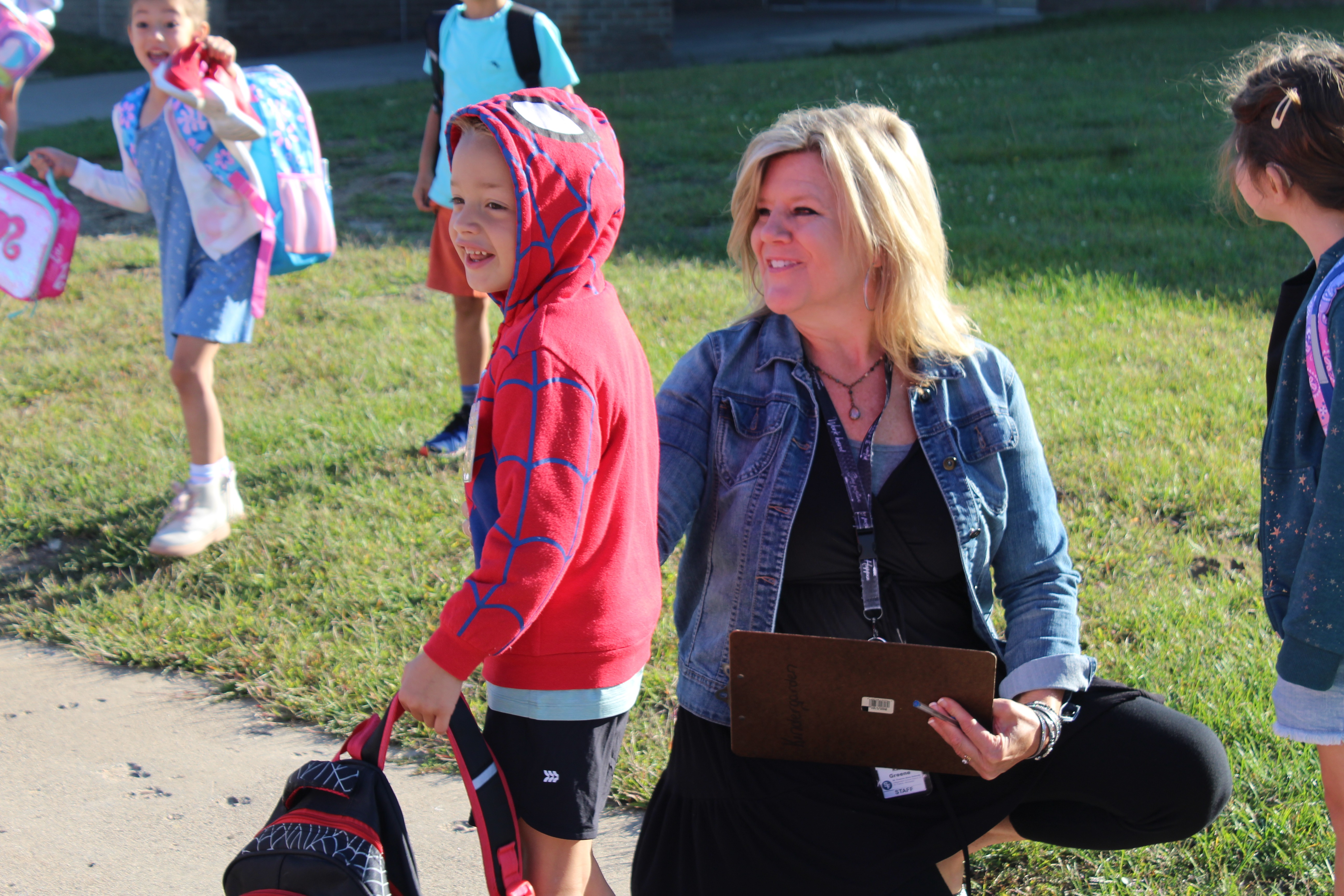 student and teacher smiling