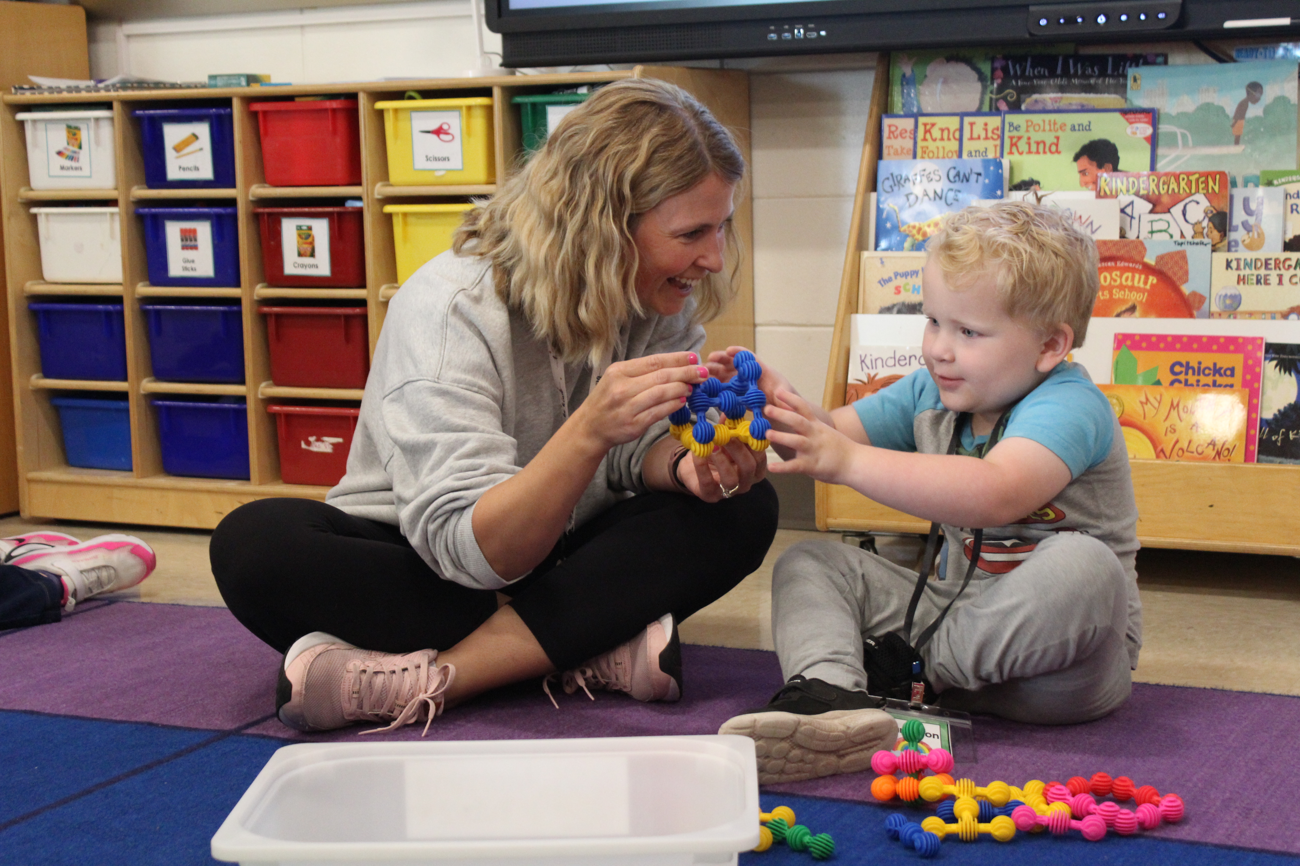 teacher interacting with student