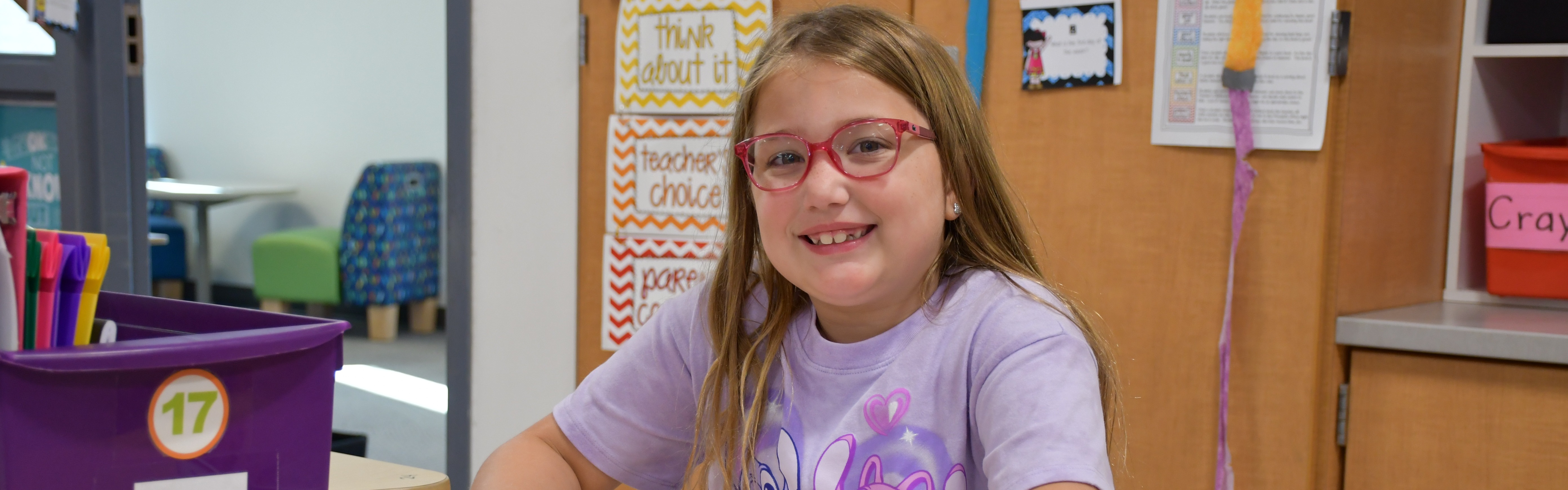 girl smiling and looking at the camera