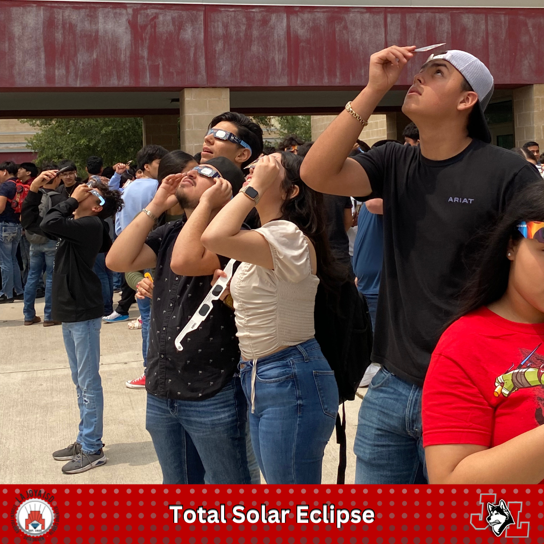 students and staff watching eclipse