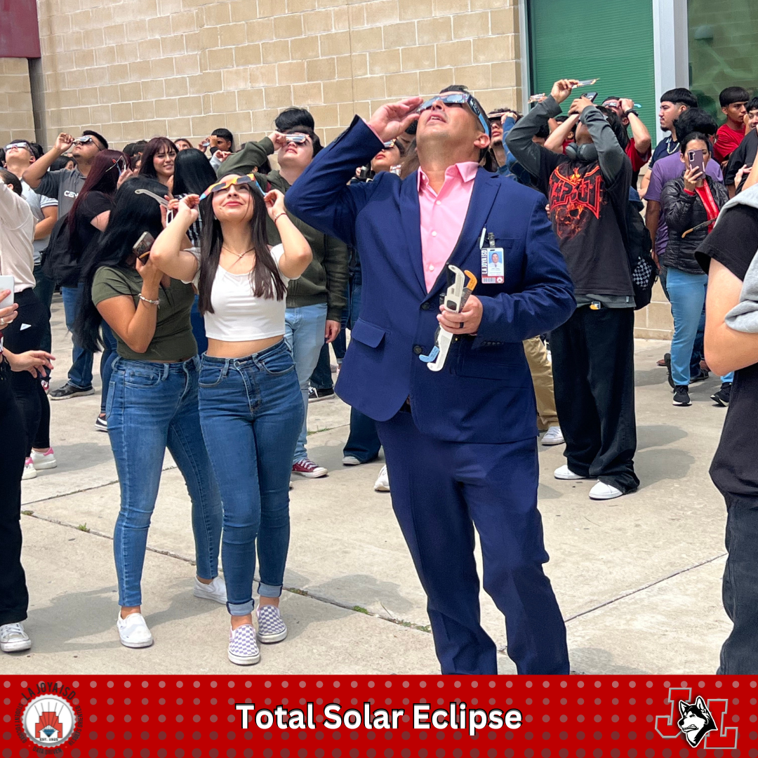 students and staff watching solar eclipse