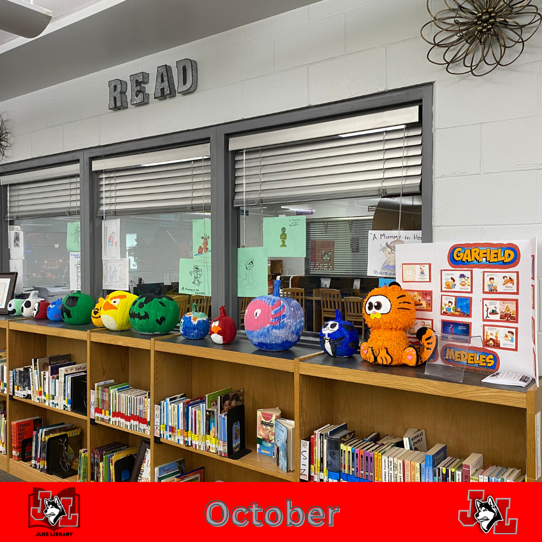 painted pumpkins on display in library