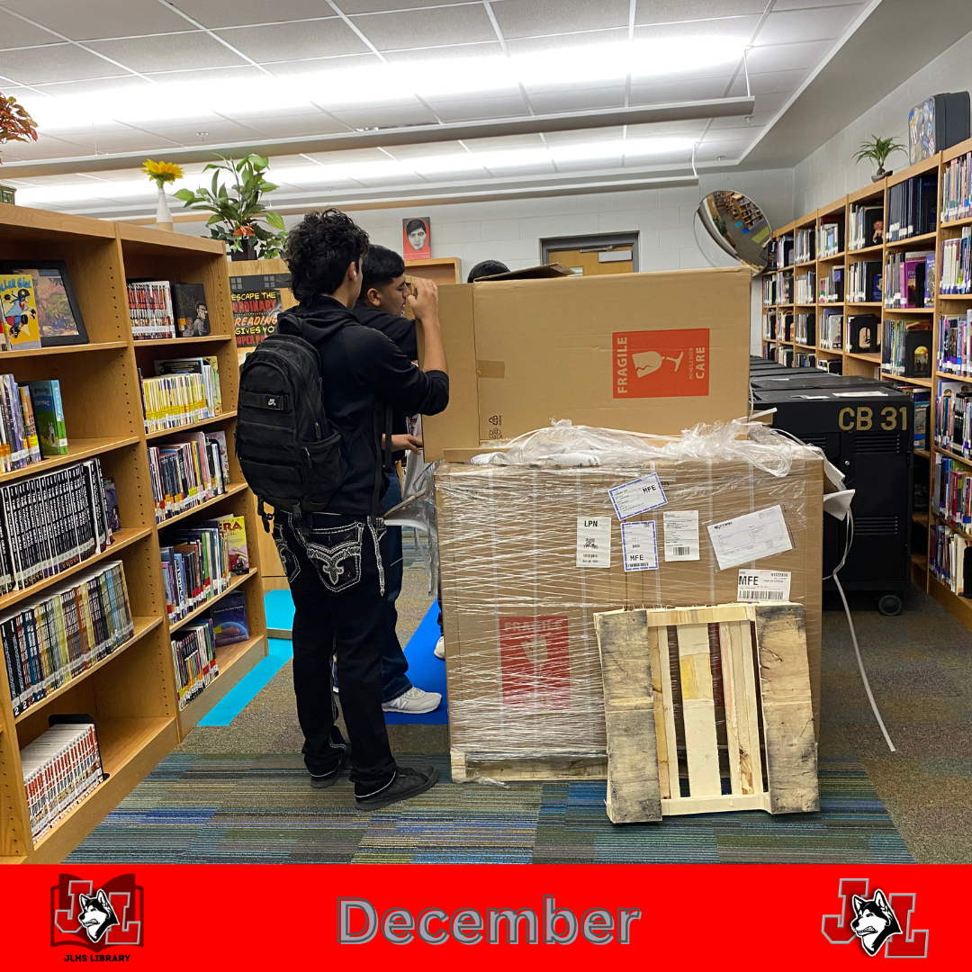 students unboxing carts in library