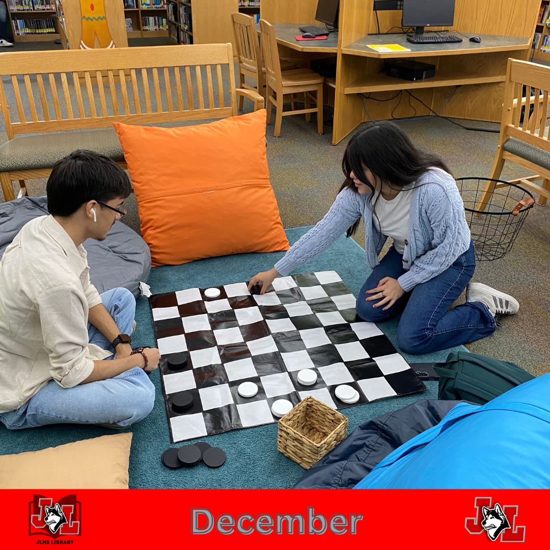 students playing chess in library